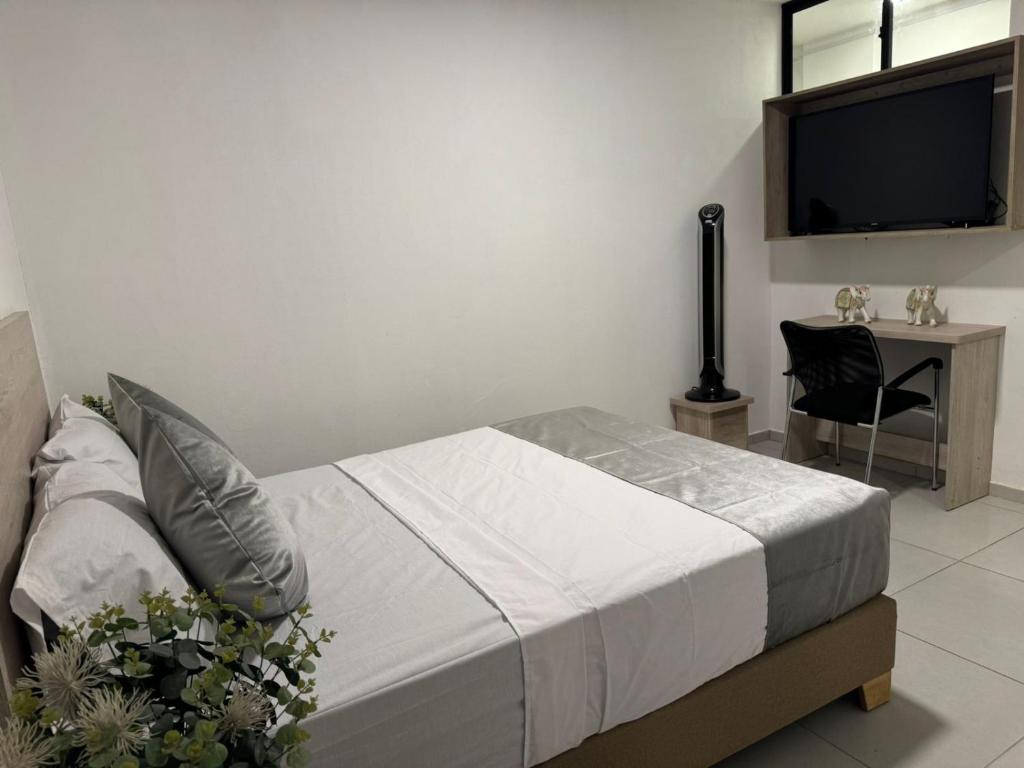 Postel nebo postele na pokoji v ubytování Hotel Med Llanogrande