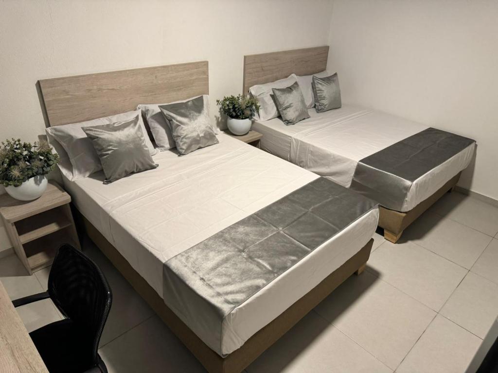 Postel nebo postele na pokoji v ubytování Hotel Med Llanogrande