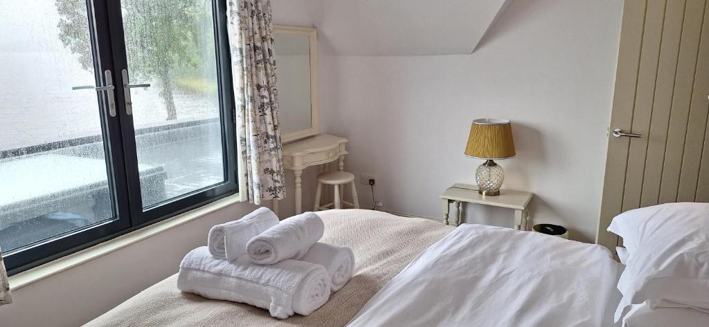 Postel nebo postele na pokoji v ubytování Lochend Chalets