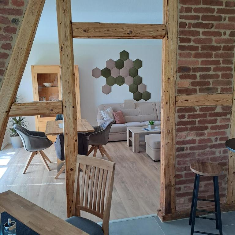 a living room with a brick wall at Fewo Verena mit 2 Schlafzimmern in Diemelsee