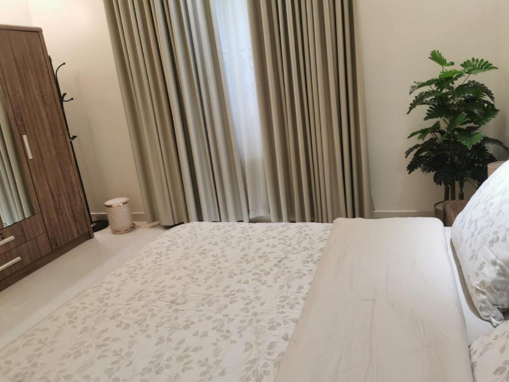 Postel nebo postele na pokoji v ubytování Camellia A
