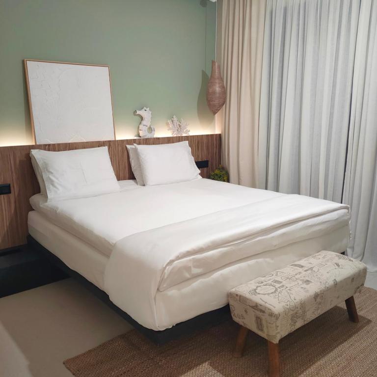 Postel nebo postele na pokoji v ubytování Contessa Suites