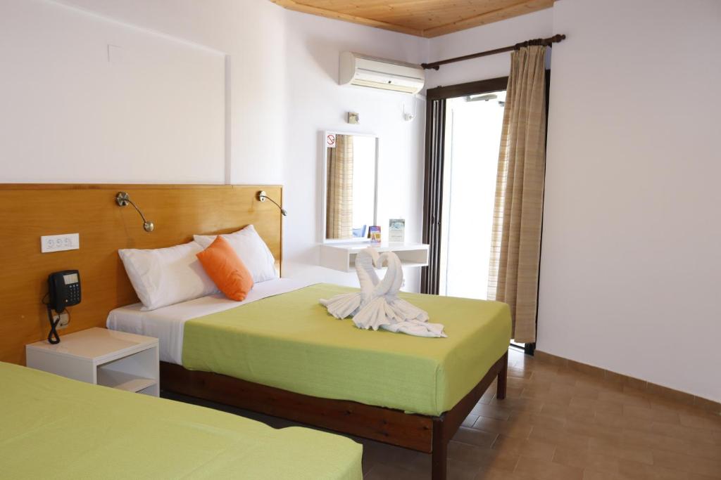 Postel nebo postele na pokoji v ubytování Valais Hotel