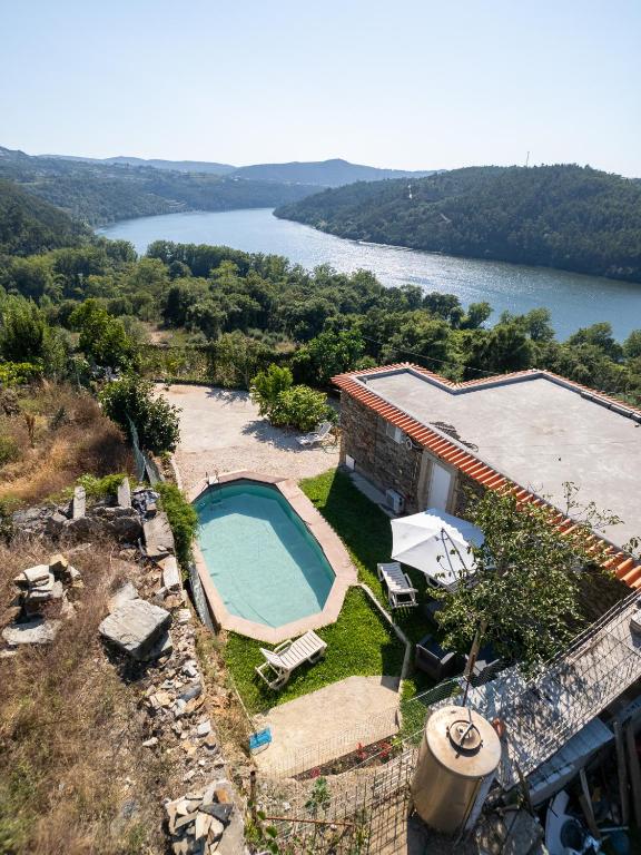 an aerial view of a house with a swimming pool at Casa das Dognas with Private Pool & Garden - Castelo de Paiva, by Hopstays in Castelo de Paiva