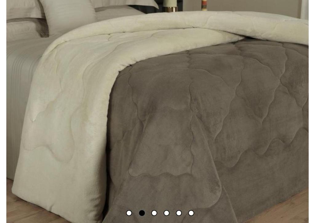 a close up of the side of a bed at Lar oliveiras, próximo cento, 500 metros de clube pinheiros in Pato Branco