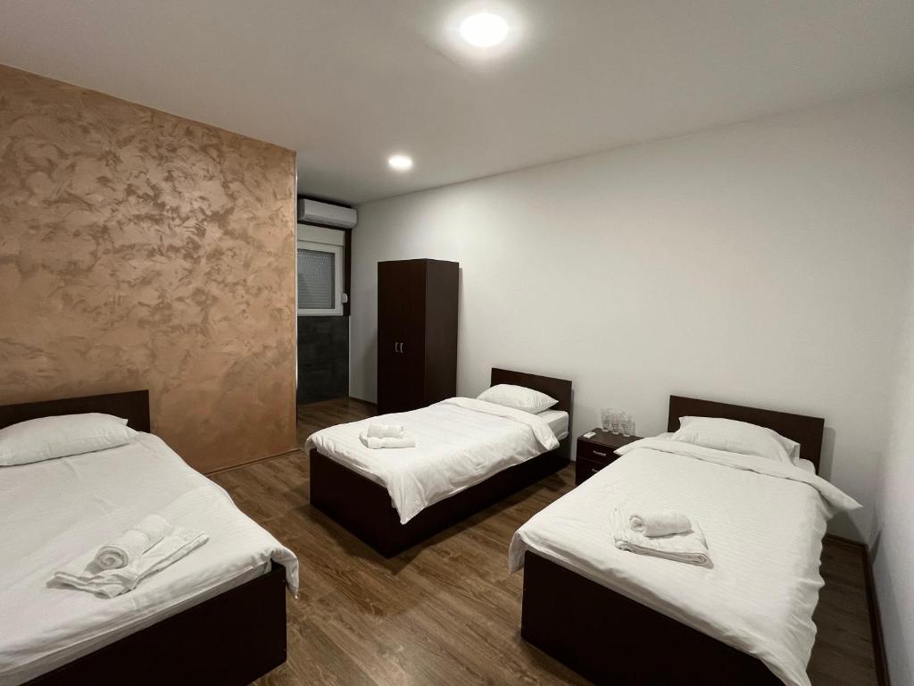 Postel nebo postele na pokoji v ubytování Apartmani Bosfor