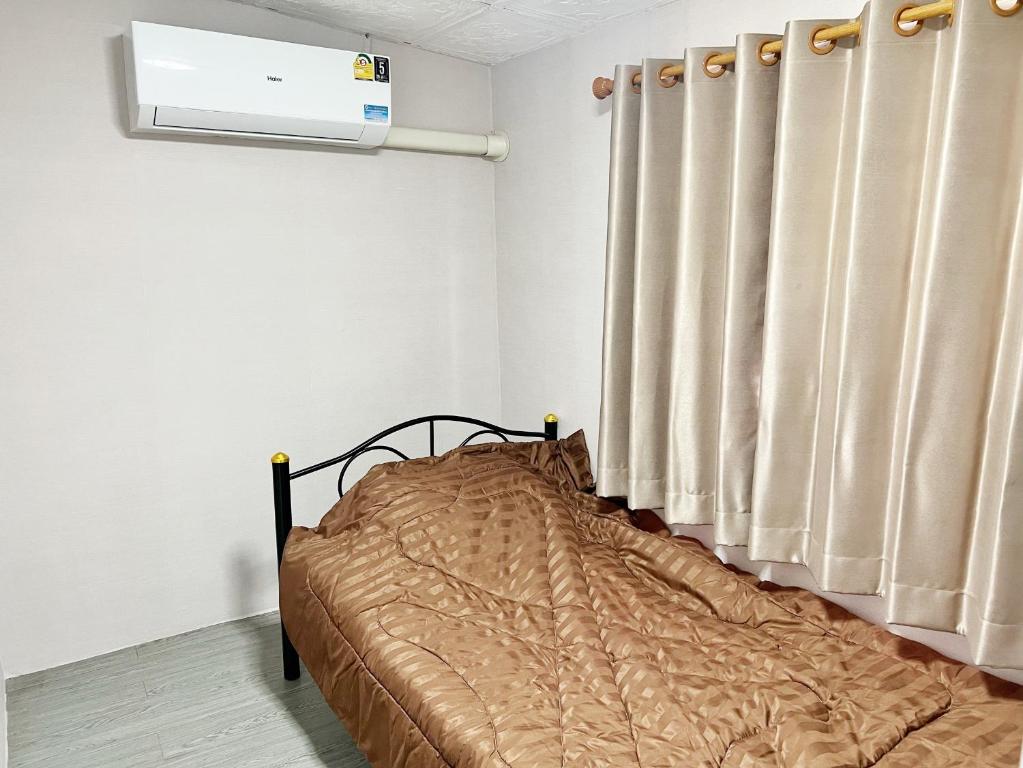 Voodi või voodid majutusasutuse บ้านเช่า Wilai Townhome Udon toas