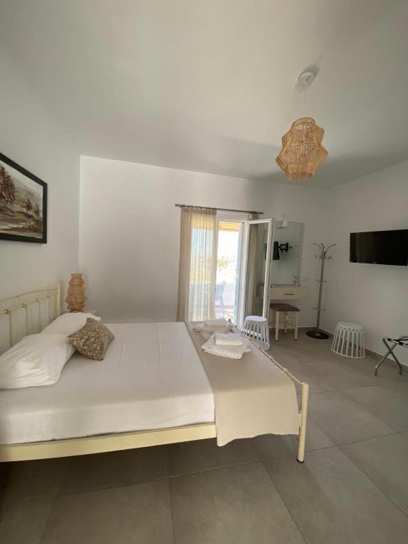 Posteľ alebo postele v izbe v ubytovaní Louros rooms