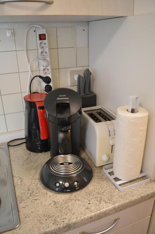 Kuchyň nebo kuchyňský kout v ubytování Logement Gare