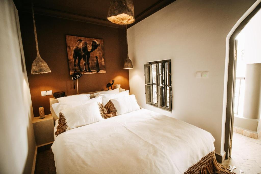 Postel nebo postele na pokoji v ubytování Riad Shabi Kasbah