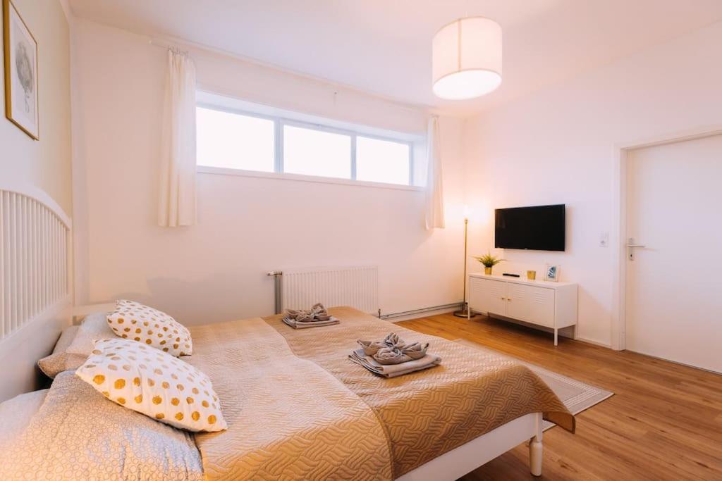 Postel nebo postele na pokoji v ubytování Cozy Bungalow inklusive free parking