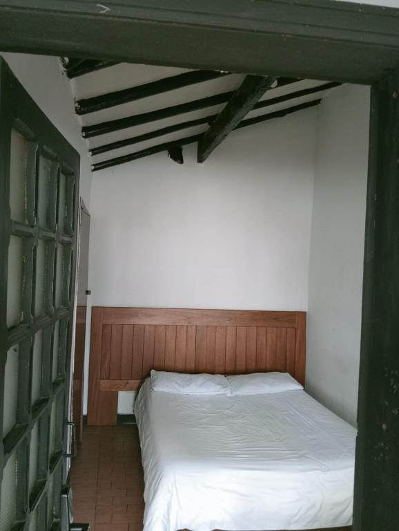 Postel nebo postele na pokoji v ubytování Villa Candelaria Hostel