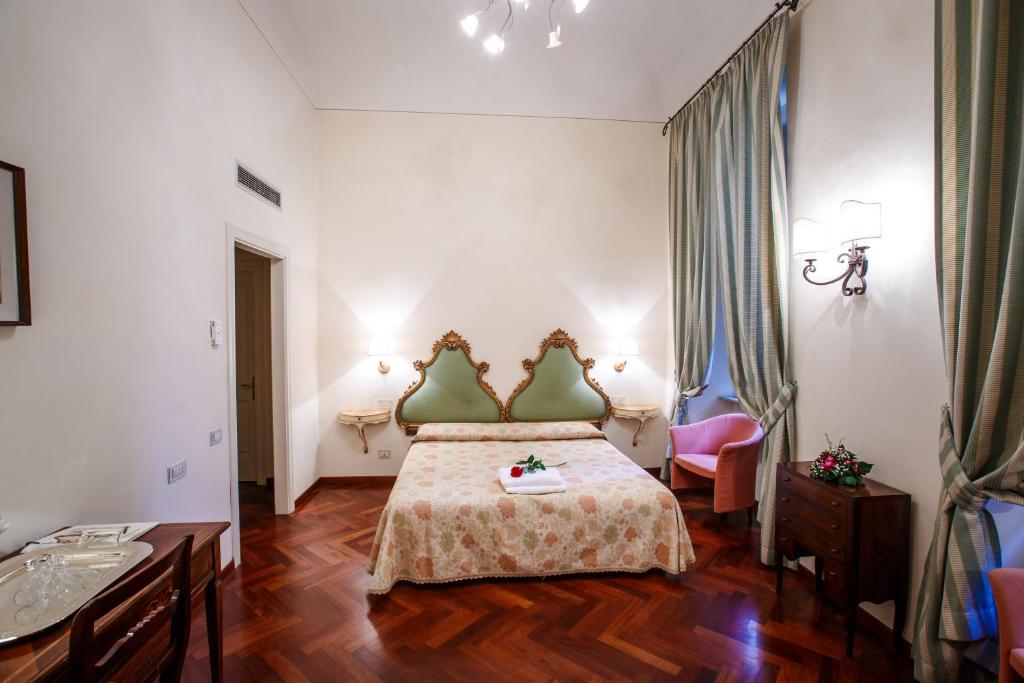 Postel nebo postele na pokoji v ubytování Hotel Fortuna