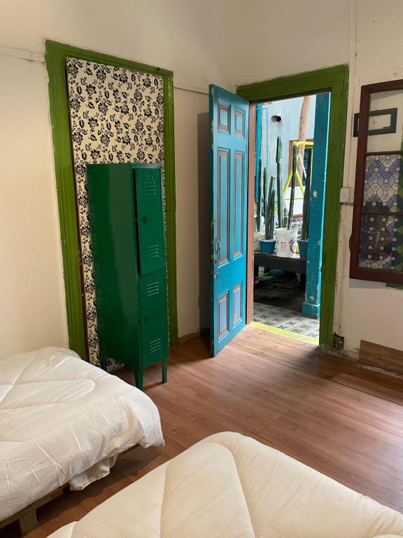 Uma cama ou camas num quarto em Art Hostel Casa Chaman