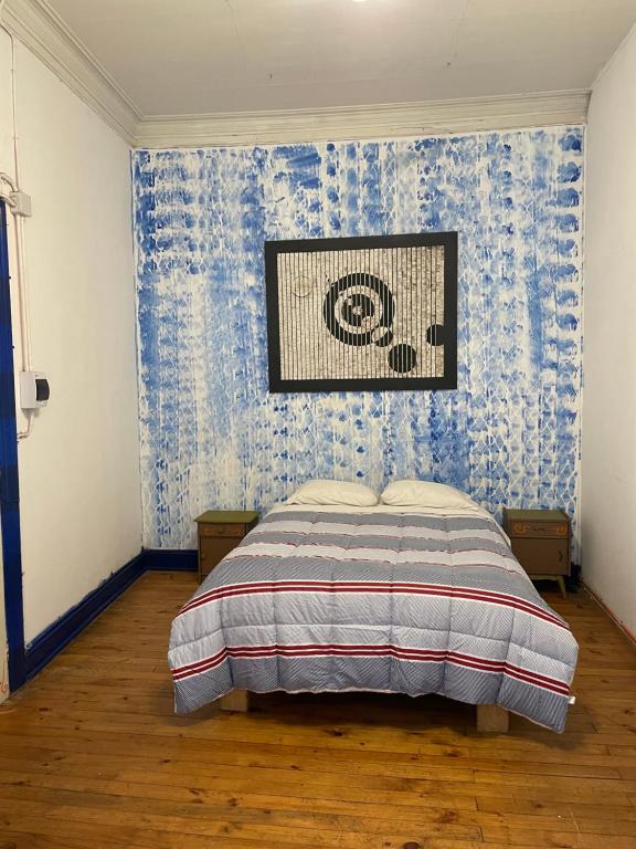 Uma cama ou camas num quarto em Art Hostel Casa Chaman