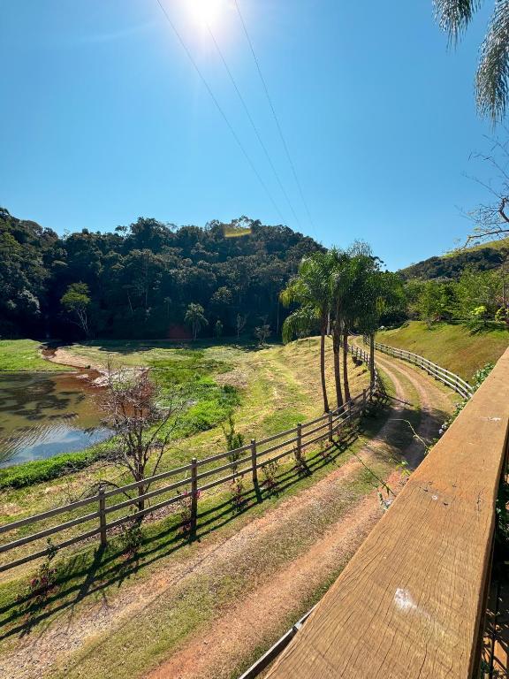 a view of a river from a wooden bridge at Pousada Shangri-lá in Cunha