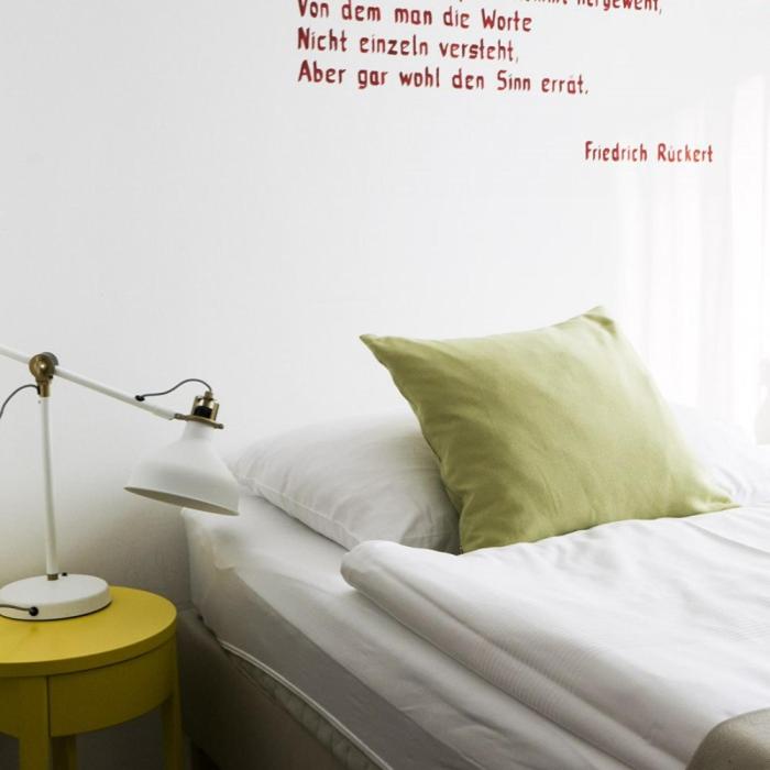 Postel nebo postele na pokoji v ubytování Hotel Villa Rückert