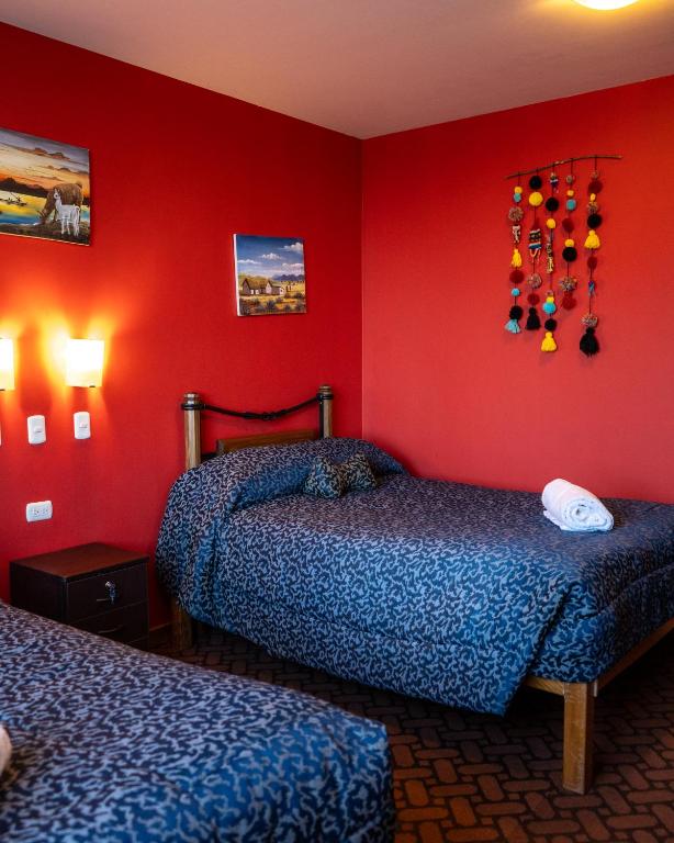 Postel nebo postele na pokoji v ubytování Hotel Pumakala