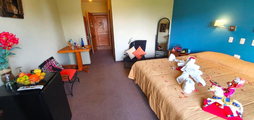 Postel nebo postele na pokoji v ubytování Hotel Pumakala
