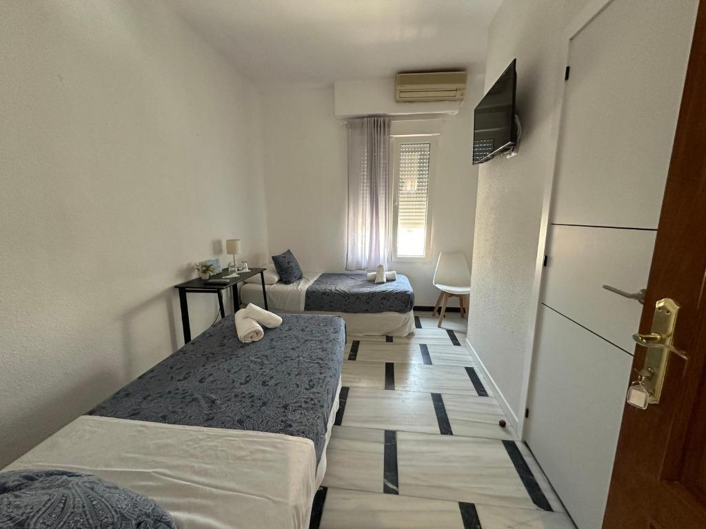 Postel nebo postele na pokoji v ubytování Hostal Arrate
