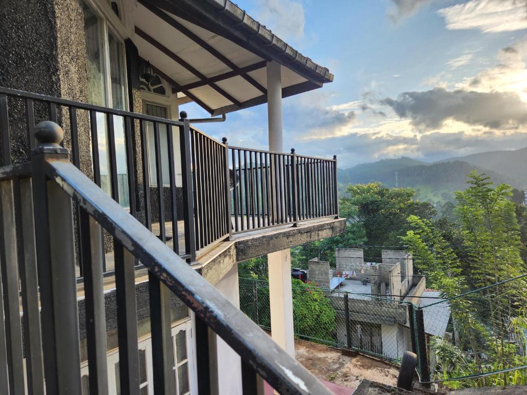 a balcony of a house with a view of a building at Suntech Holiday Home Bandarawela in Bandarawela