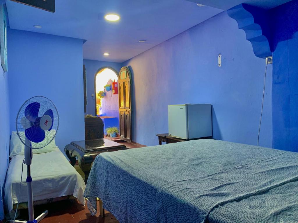 Postel nebo postele na pokoji v ubytování Hôtel Barcelona