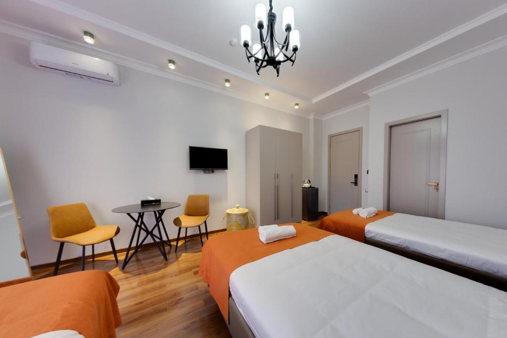 Postel nebo postele na pokoji v ubytování Sun Wine Hotel