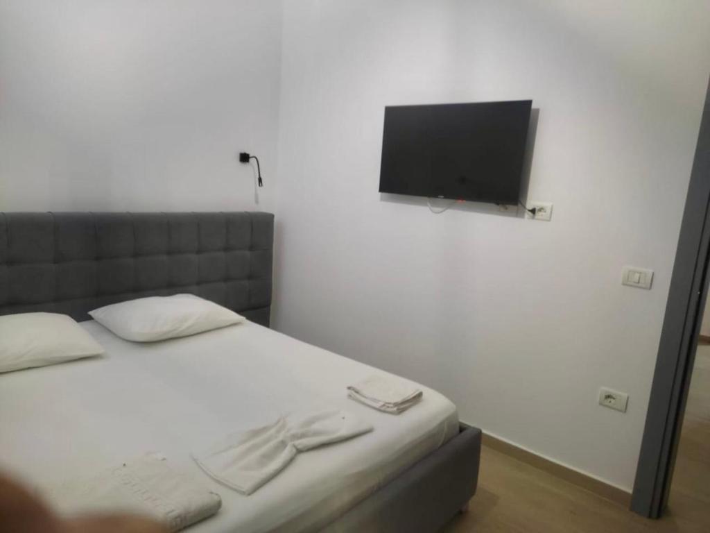 Postel nebo postele na pokoji v ubytování Petros rooms