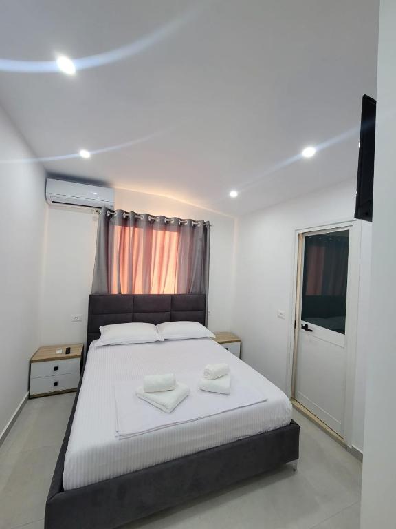 Postel nebo postele na pokoji v ubytování CACA Hotel