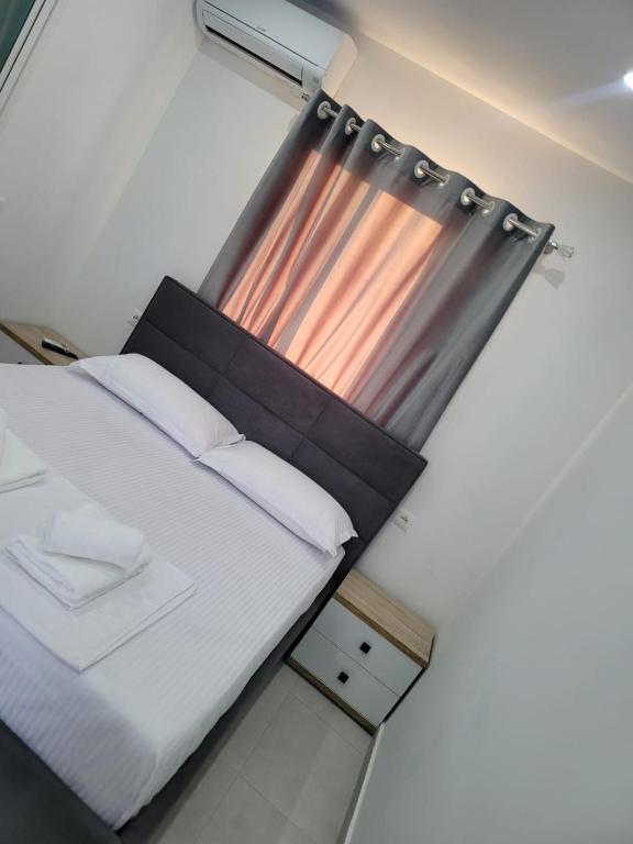 Postel nebo postele na pokoji v ubytování CACA Hotel