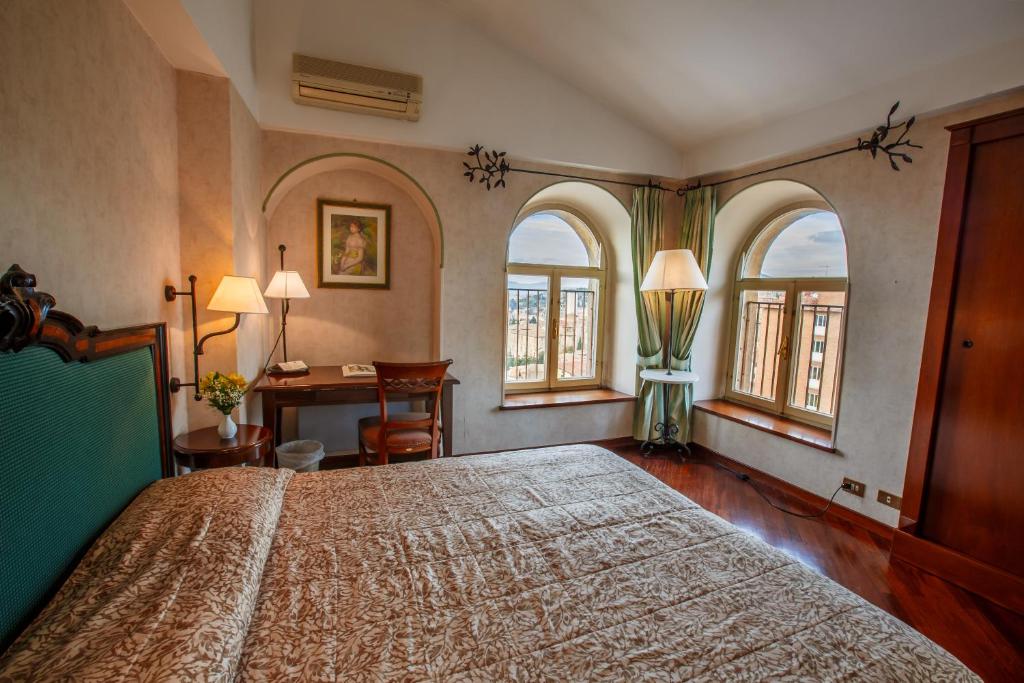Postel nebo postele na pokoji v ubytování Hotel Fortuna