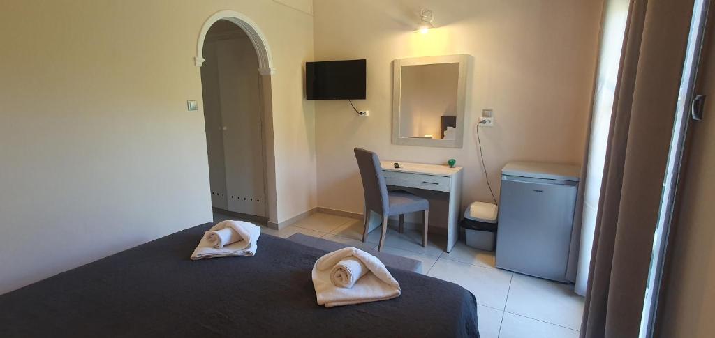 Postel nebo postele na pokoji v ubytování Paleo Inn Hotel