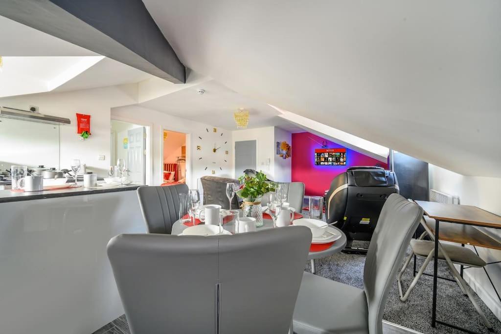 a dining room with a table and chairs at -4F421- For your Relaxed,Cosy stay,Free Parking in Batley