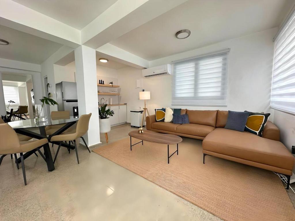 a living room with a couch and a table at Beautifully Renovated 3 Rooms Home I in San Juan