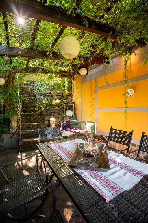a table and chairs on a patio at Domček Ľúbezný in Banská Štiavnica