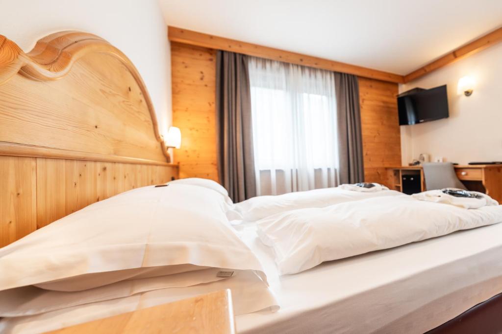 Postel nebo postele na pokoji v ubytování Hotel St. Michael