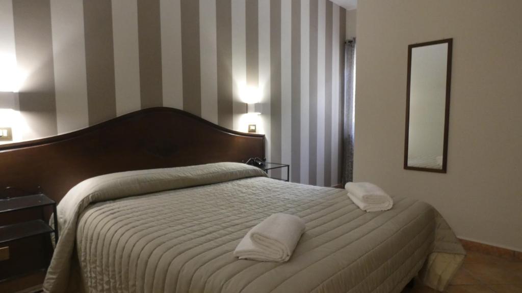 Postel nebo postele na pokoji v ubytování Hotel Piscina La Suite