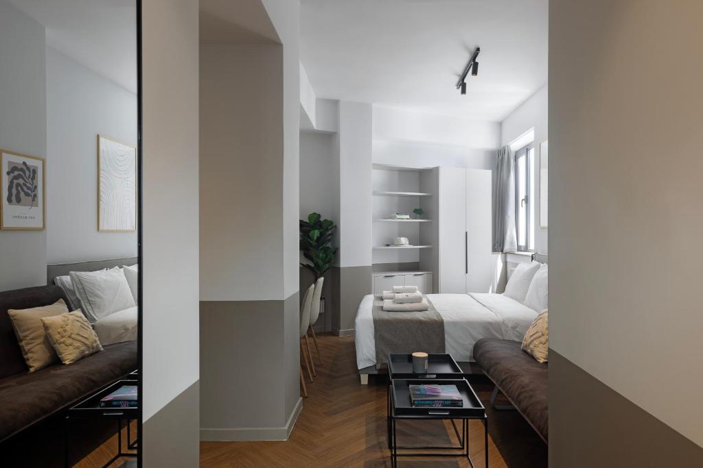 Postel nebo postele na pokoji v ubytování Ermass Modern Living Apartments