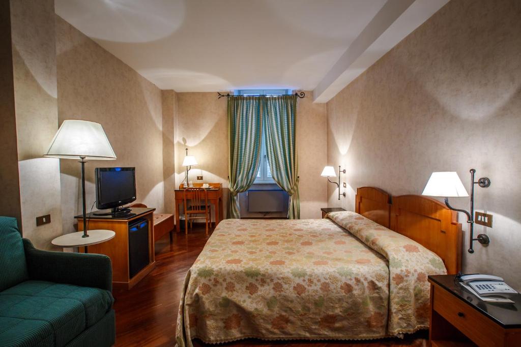 Postel nebo postele na pokoji v ubytování Hotel Fortuna