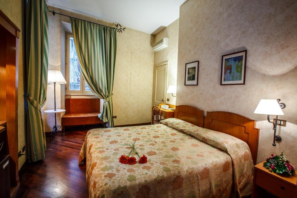 Postel nebo postele na pokoji v ubytování Hotel Fortuna