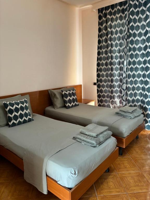 Postel nebo postele na pokoji v ubytování Hotel Vlora 78