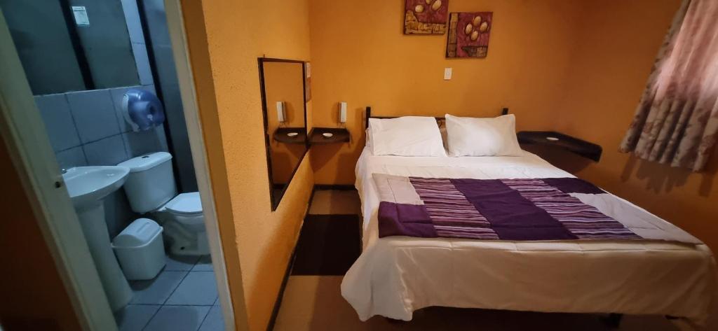 Postel nebo postele na pokoji v ubytování Hotel Fish
