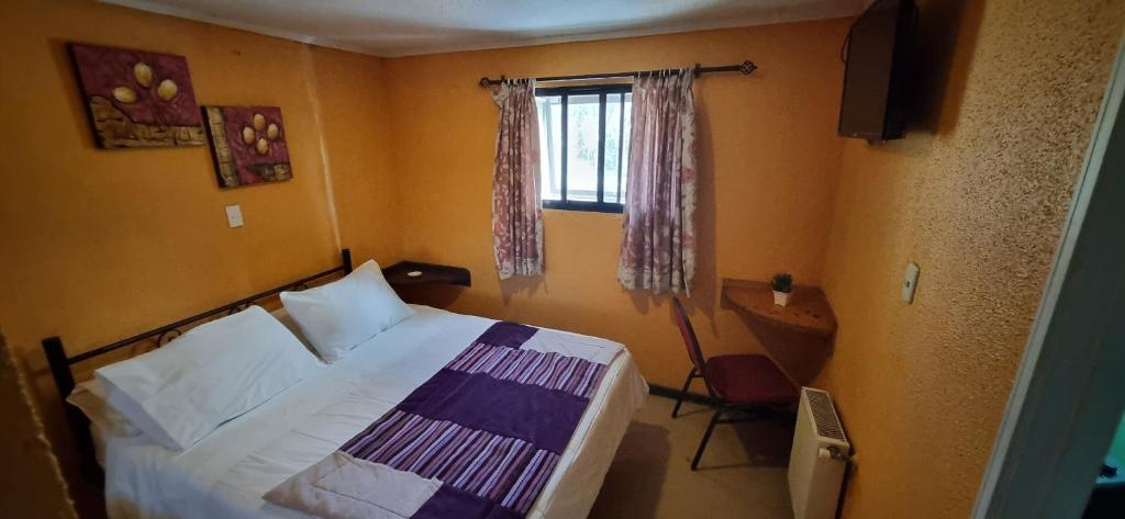 Postel nebo postele na pokoji v ubytování Hotel Fish
