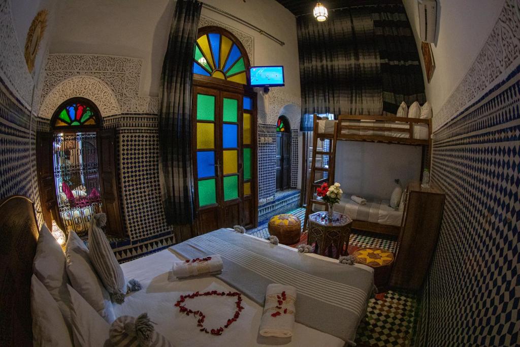 Postel nebo postele na pokoji v ubytování Riad LalaMoune