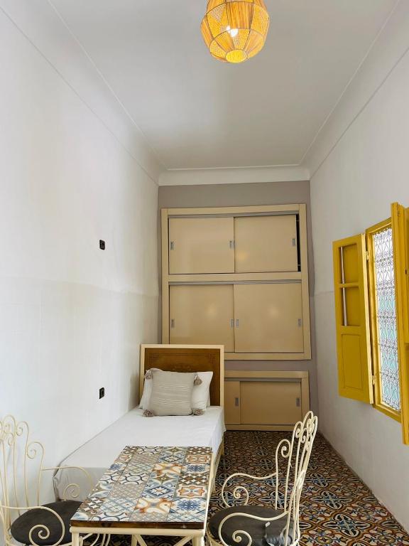 Postel nebo postele na pokoji v ubytování The Madrassa Hostel