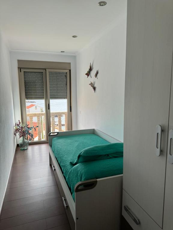 Łóżko lub łóżka w pokoju w obiekcie CASA LELA