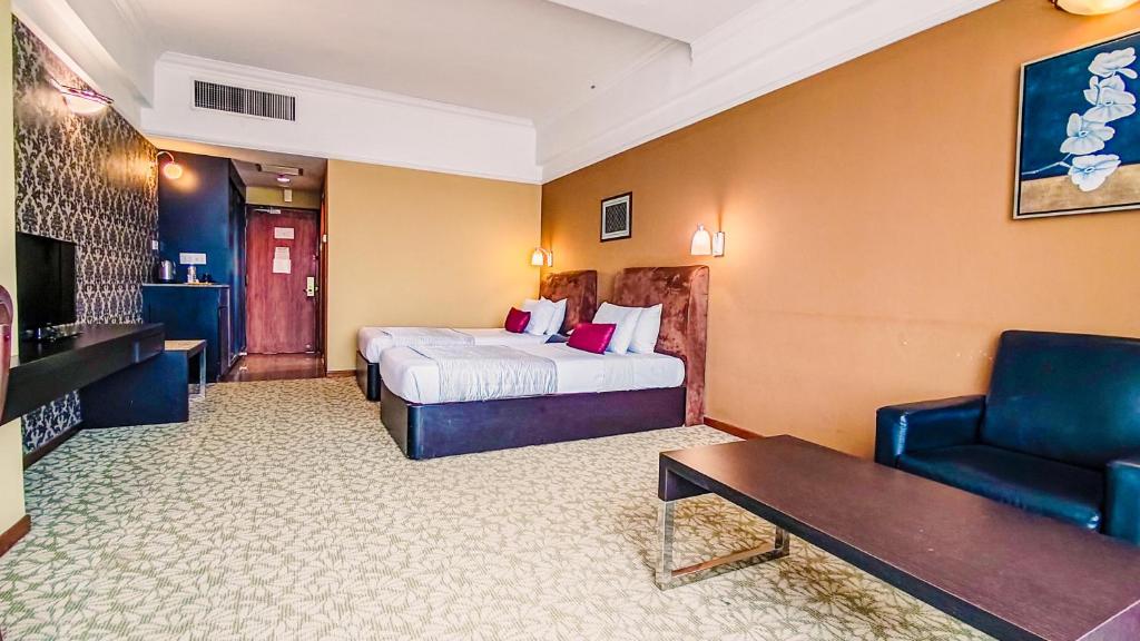 Postel nebo postele na pokoji v ubytování New York Hotel