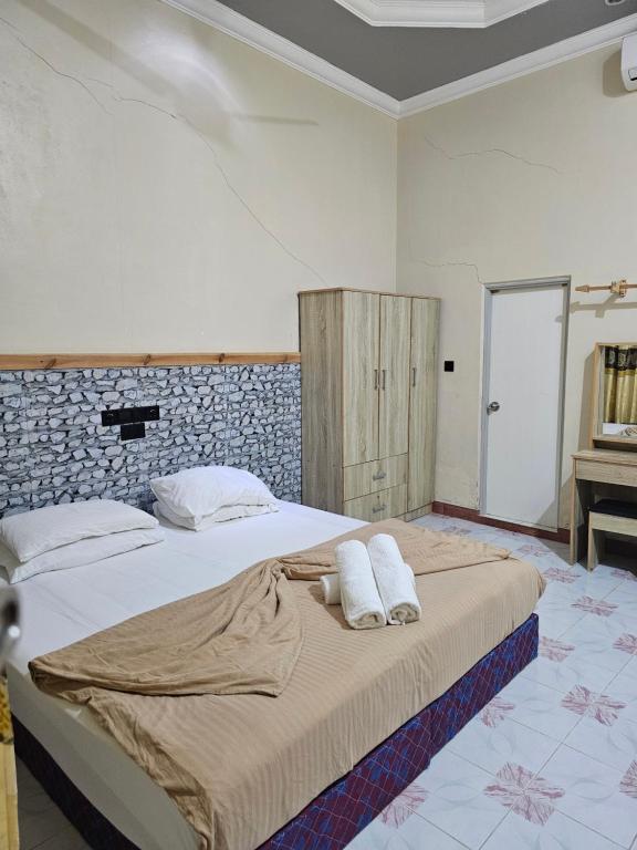Postel nebo postele na pokoji v ubytování Coquillage Inn