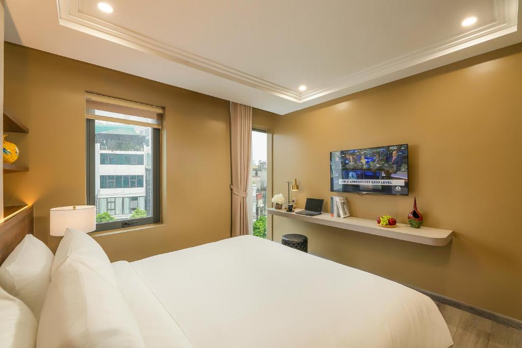 TV a/nebo společenská místnost v ubytování Gilson Hanoi Hotel