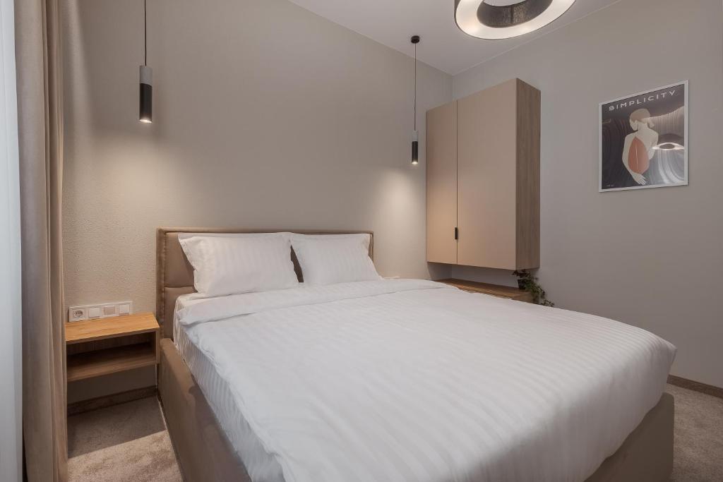 Postel nebo postele na pokoji v ubytování Oasis Rooms